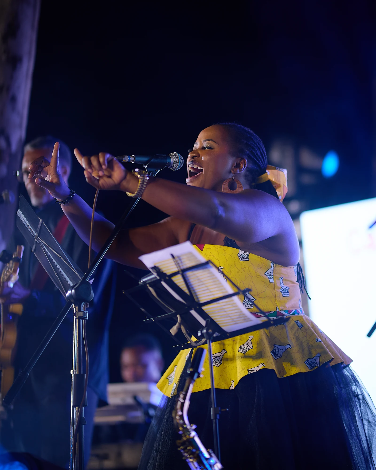 Tina Watyoka singing on stage